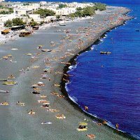 The Black Sandy Beach of Kamari Village in Santorini Island Greece - Click on the image to enlarge