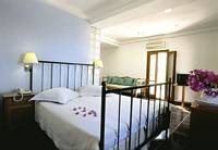 Santorini Palace Hotel, Santorini - Bedroom / click image to enlarge