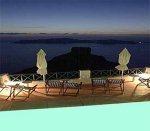 Sunny Villas evening pool view, Imerovigli, Santorini island, Cyclades, Greece / click image to enlarge